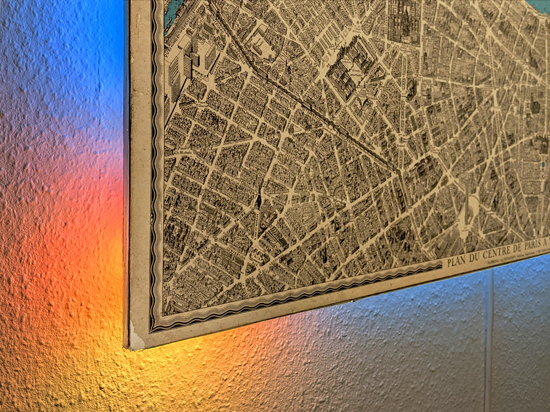 Close-up of the Solar/Lunar Map showing an antique map of Paris with indirect LEDs indicating the current solar position
